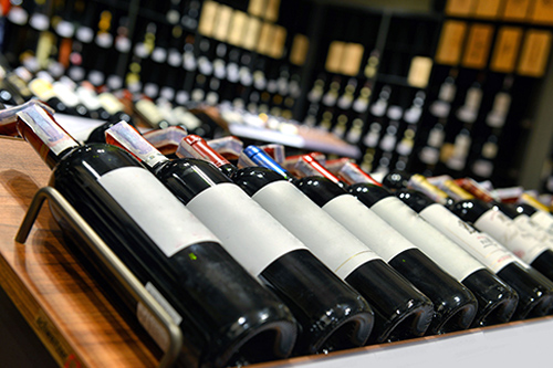 bottles of wine on a rack 