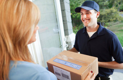 man delivering a box to a woman